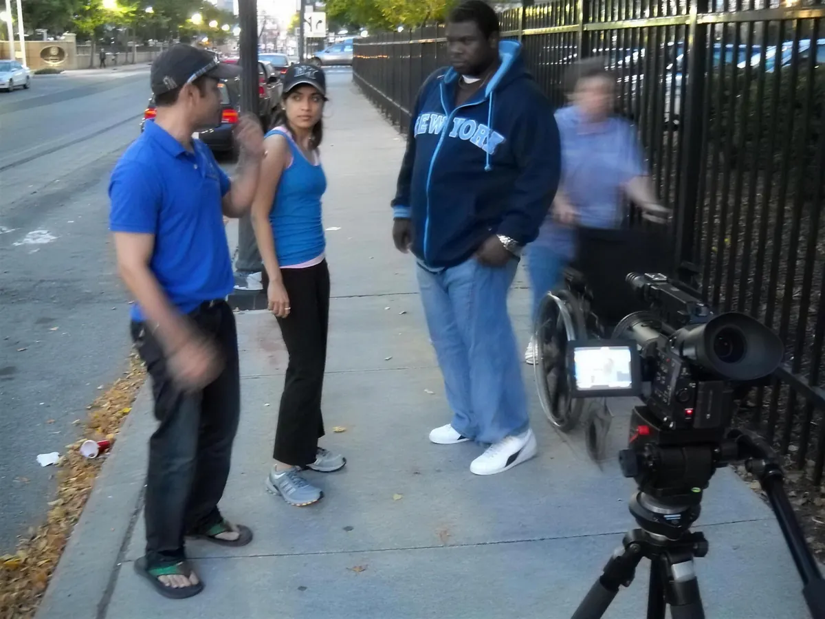 Blocking a scene on the sidewalk